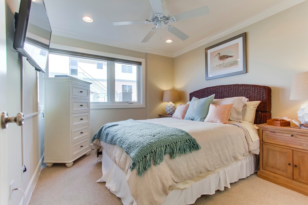 Photo of a beach style bedroom in San Diego with beige walls.