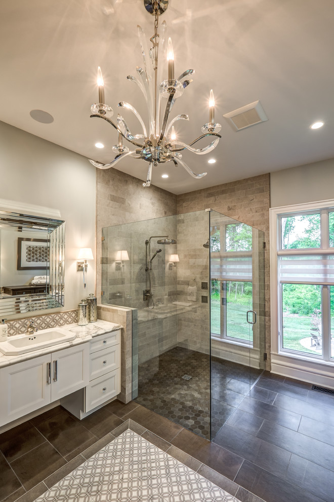 Design ideas for an expansive transitional master bathroom in Other with subway tile, white cabinets, a corner shower, grey walls, porcelain floors, a drop-in sink, marble benchtops, brown floor, a hinged shower door, multi-coloured benchtops and recessed-panel cabinets.