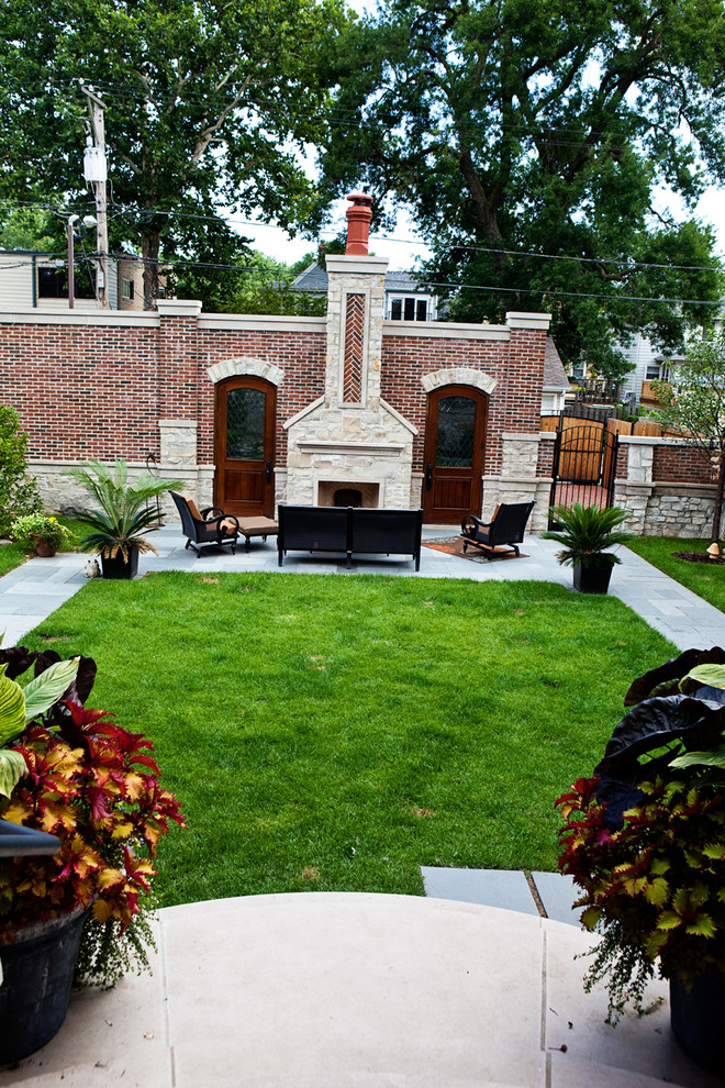 Photo of a large traditional backyard patio in Chicago with decking, no cover and a fire feature.