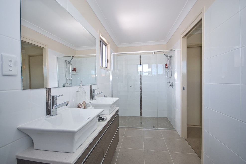 This is an example of a mid-sized contemporary master bathroom in Brisbane with flat-panel cabinets, dark wood cabinets, an alcove shower, brown tile, white tile, porcelain tile, white walls, cement tiles, a vessel sink and granite benchtops.