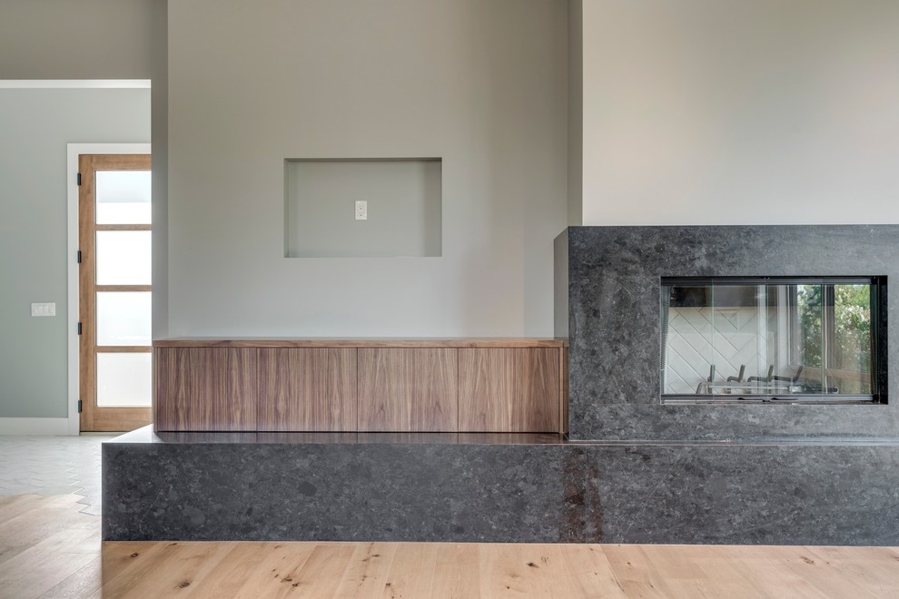 Example of a transitional home design design in Calgary