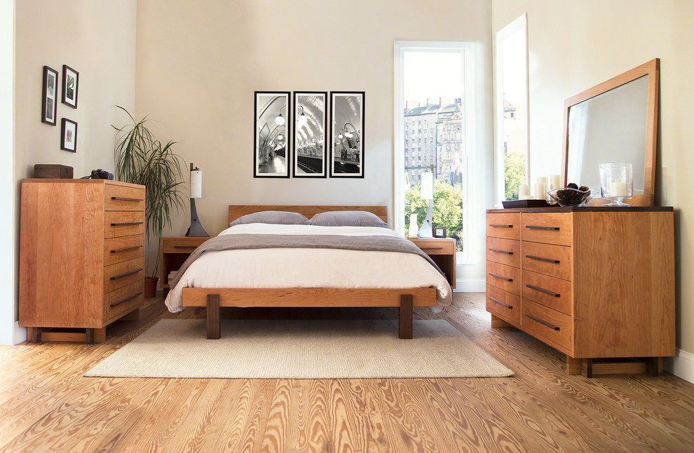 Example of a mid-sized minimalist master bedroom design in Burlington with white walls