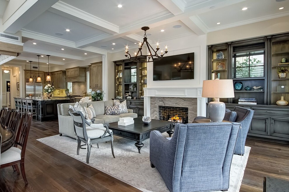 Mid-sized traditional formal open concept living room in Orange County with grey walls, dark hardwood floors, a standard fireplace, a tile fireplace surround, a wall-mounted tv and brown floor.