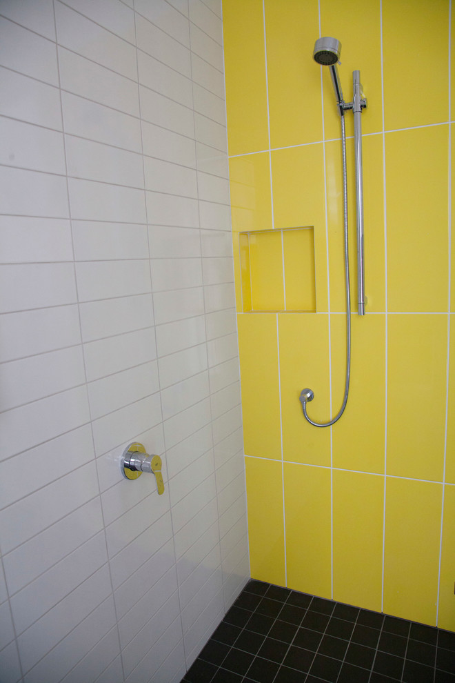 Photo of a contemporary bathroom in Sydney with yellow tile and white walls.