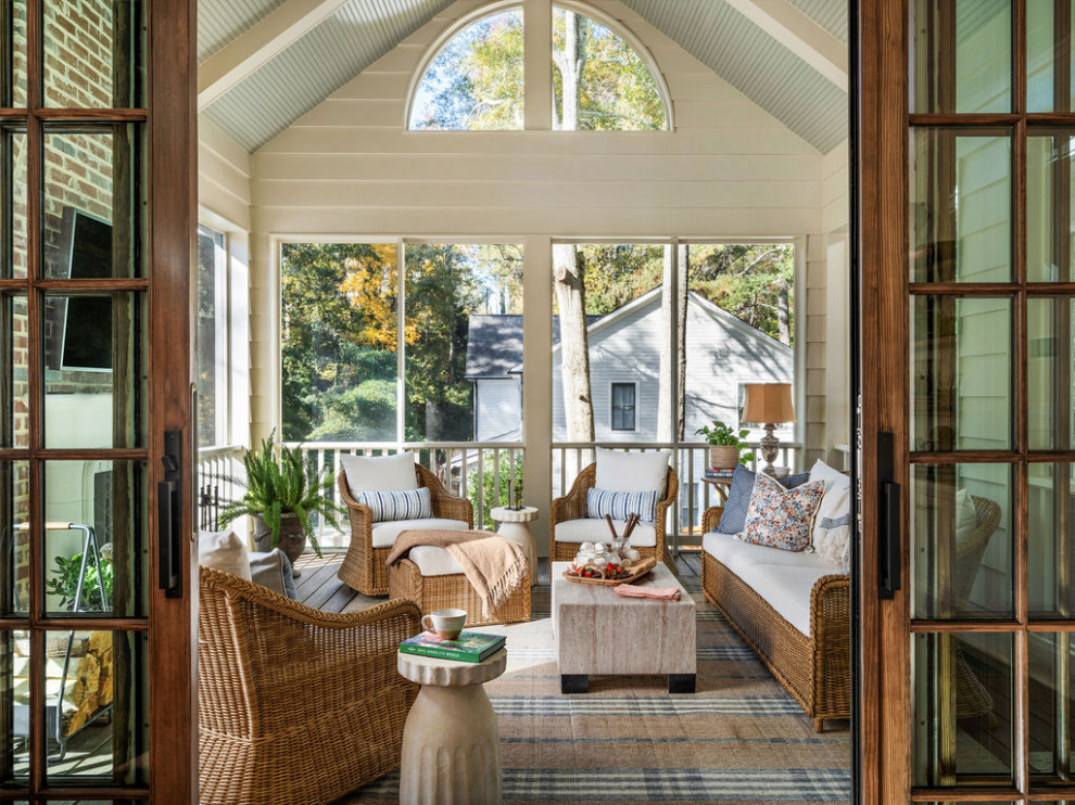 Classic screened-in back porch idea in Atlanta with a roof extension