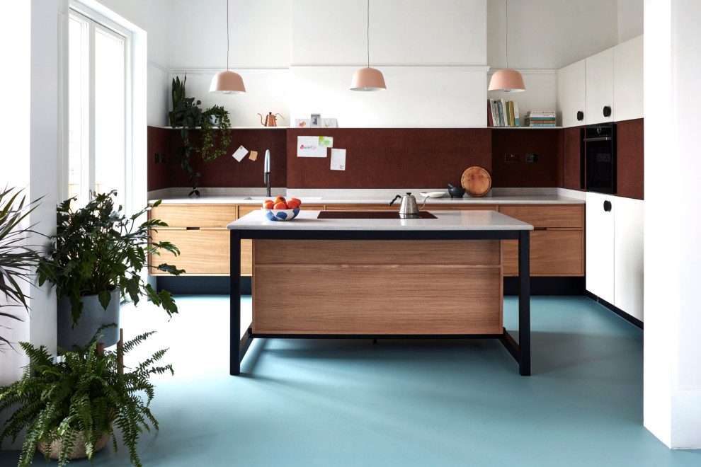 Photo of a mid-sized contemporary l-shaped eat-in kitchen in Other with a drop-in sink, flat-panel cabinets, medium wood cabinets, quartzite benchtops, brown splashback, timber splashback, black appliances, vinyl floors, with island, blue floor and grey benchtop.
