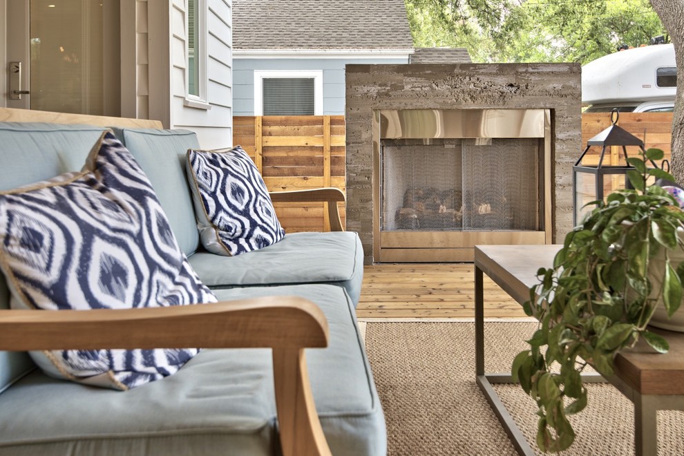 Transitional deck photo in Austin with a fire pit