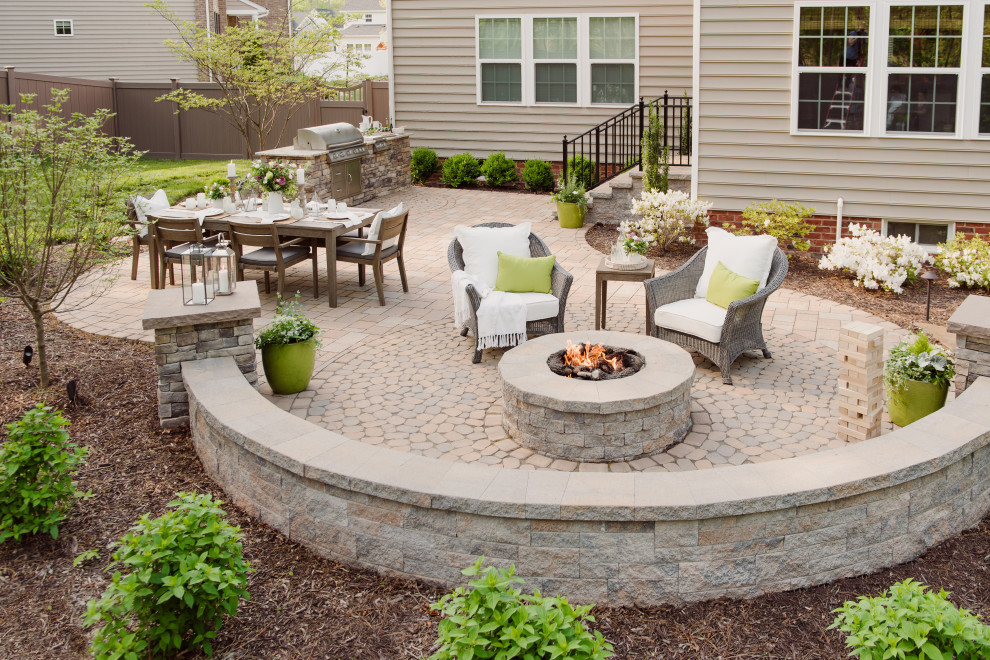 Inspiration for a medium sized traditional back patio in Richmond with a fire feature, concrete paving and no cover.