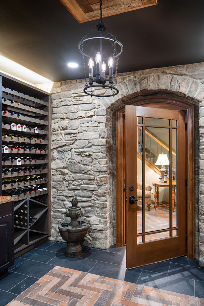 Mid-sized country wine cellar in Columbus with porcelain floors and multi-coloured floor.