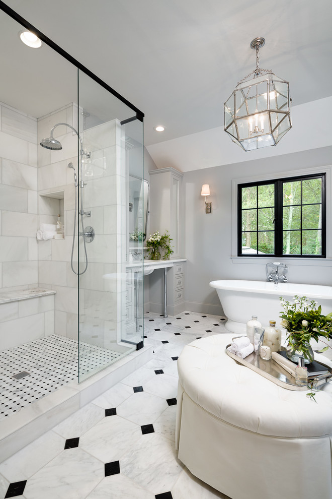 Large traditional master bathroom in Other with a freestanding tub, marble floors, an undermount sink, marble benchtops, open cabinets, grey cabinets, a double shower, a one-piece toilet, black and white tile, stone tile and grey walls.