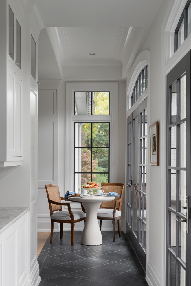 Country dining room in Milwaukee with white walls, marble floors, grey floor and recessed.