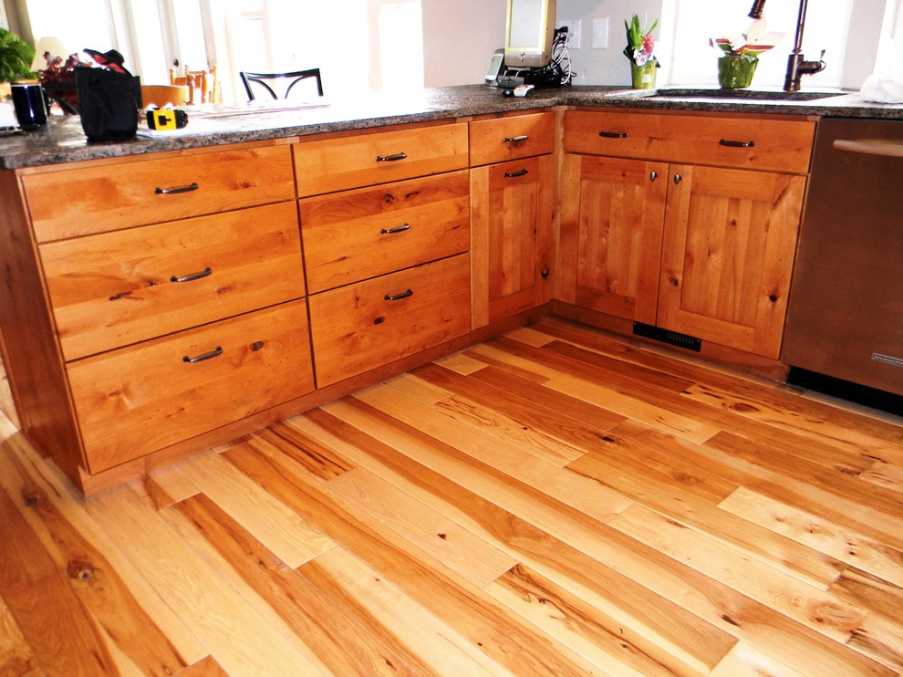 Example of a light wood floor kitchen design in Seattle with flat-panel cabinets, medium tone wood cabinets and granite countertops