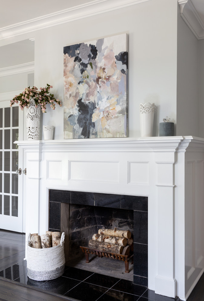 Example of a mid-sized beach style formal and enclosed medium tone wood floor and brown floor living room design in New York with blue walls, a standard fireplace, a stone fireplace and no tv