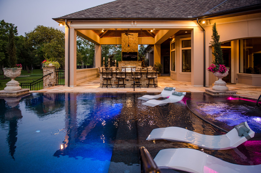 Mid-sized contemporary backyard custom-shaped lap pool in Houston with a hot tub and tile.