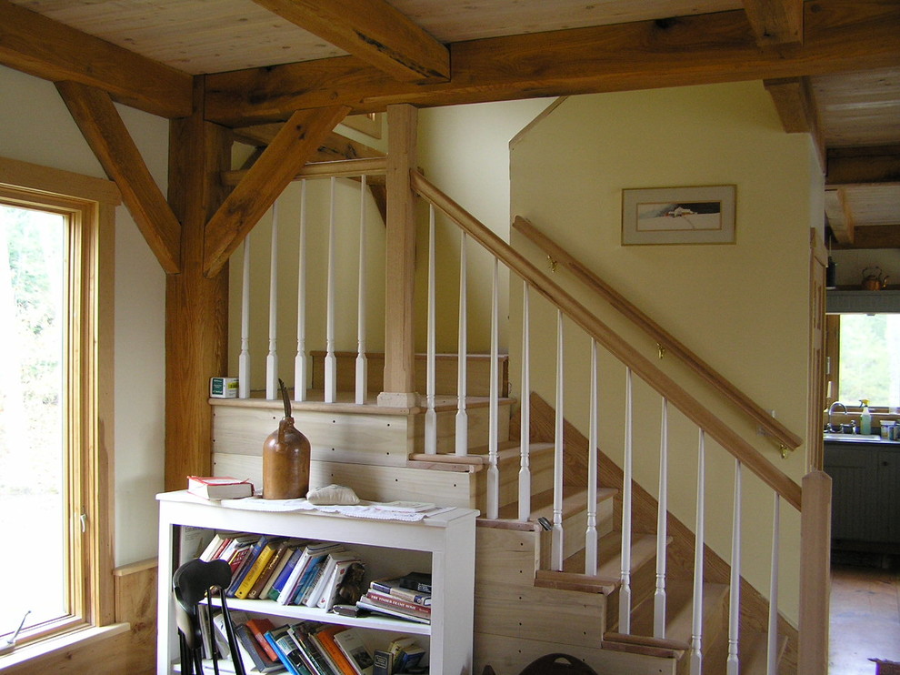 Inspiration for a mid-sized country wood u-shaped staircase in Boston with wood risers.