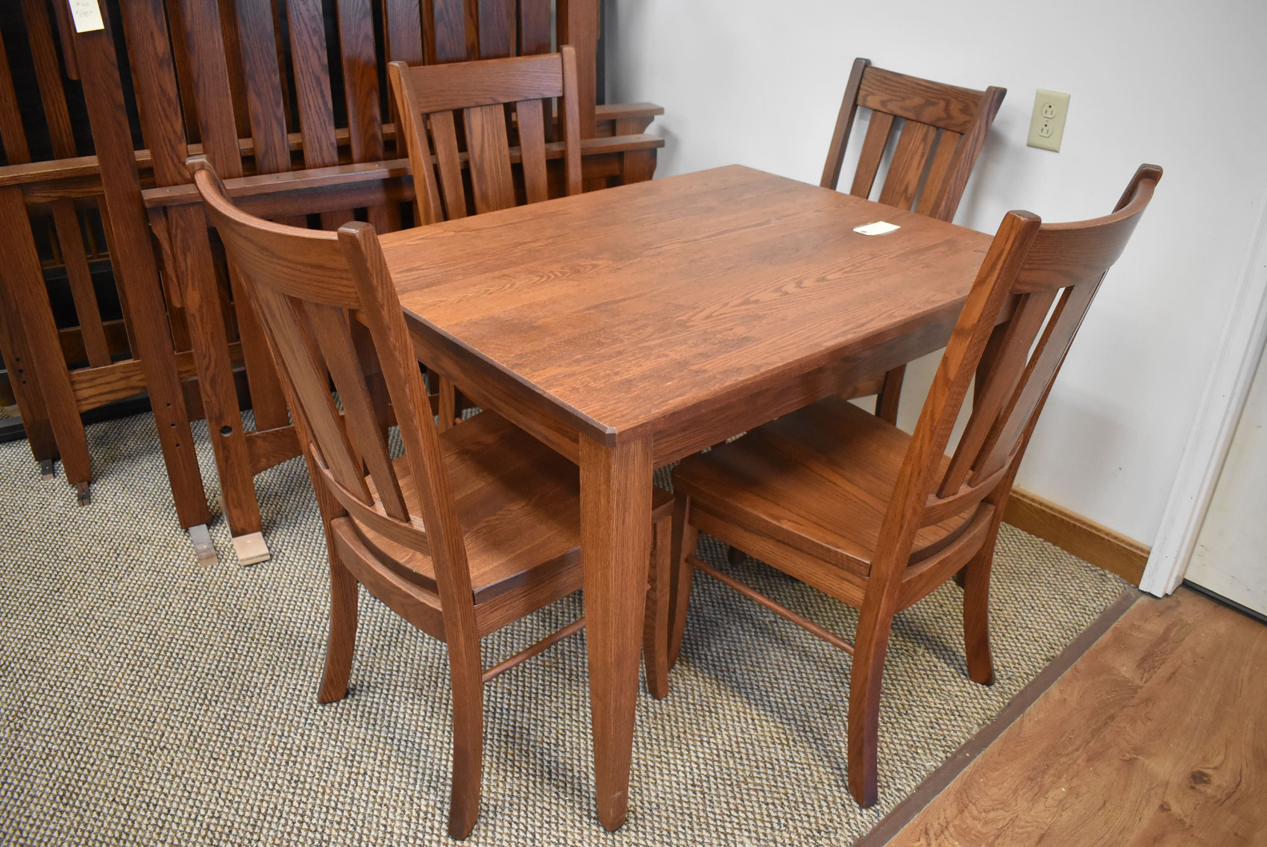 34 x 43 solid top table with Oxford chairs