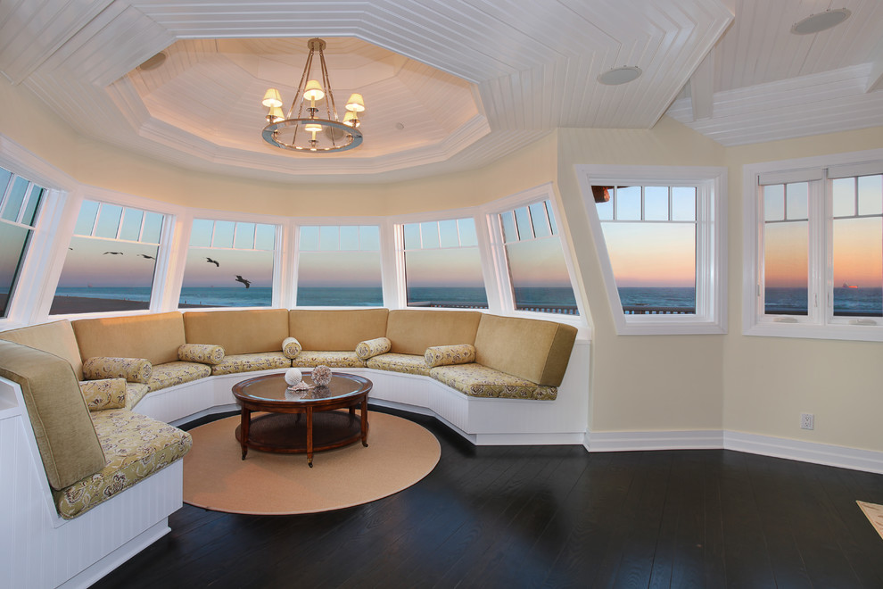 Photo of a large beach style sunroom in Orange County with dark hardwood floors.