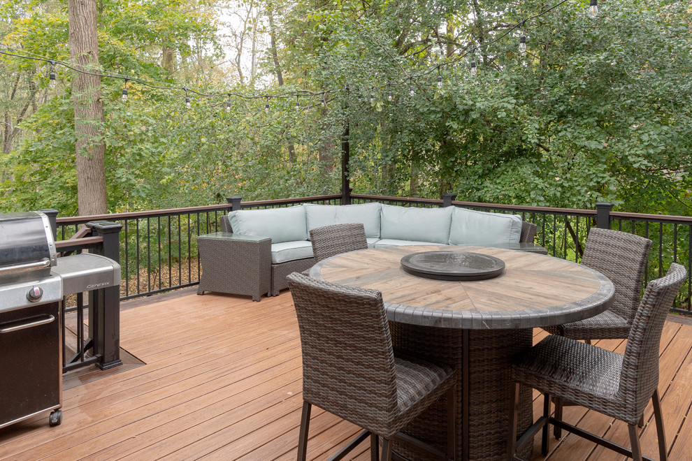 Mid-sized transitional backyard deck photo with no cover