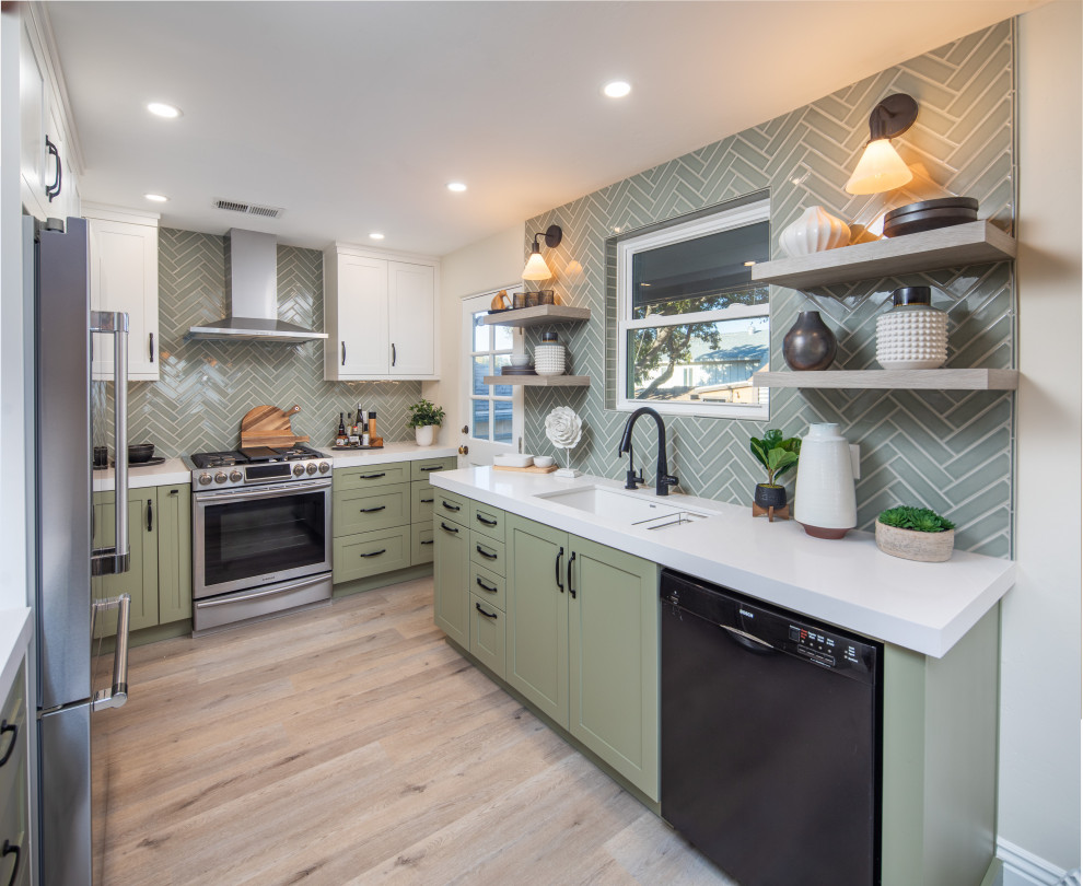 Mid-sized transitional u-shaped vinyl floor and gray floor eat-in kitchen photo in San Diego with an undermount sink, shaker cabinets, green cabinets, quartz countertops, green backsplash, ceramic backsplash, stainless steel appliances, no island and white countertops