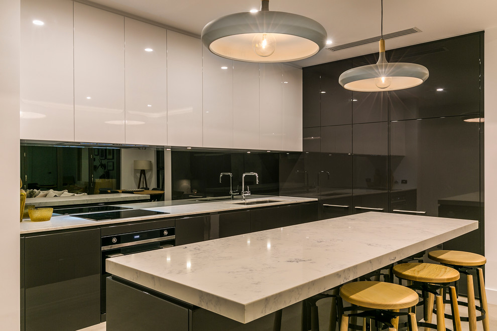 Inspiration for a contemporary kitchen in Adelaide with solid surface benchtops, porcelain floors and with island.
