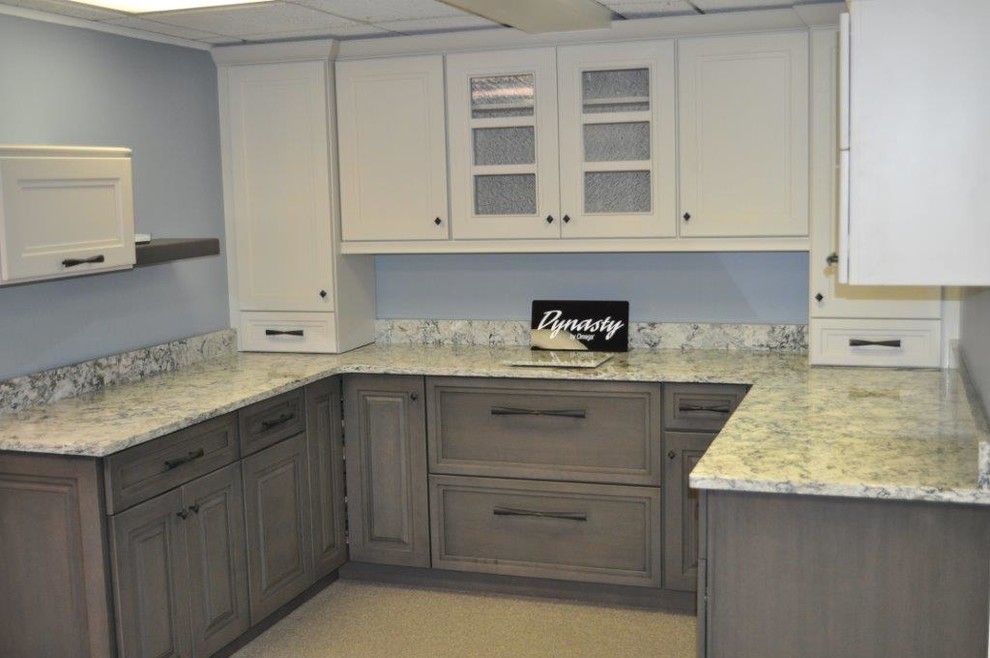 Mid-sized transitional u-shaped enclosed kitchen photo in Chicago with shaker cabinets, white cabinets, granite countertops and no island
