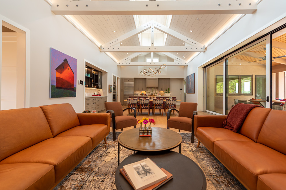 St. Andrews Napa CA Rebuild - This home in Napa off Silverado was rebuilt after burning down in the 2017 fires. Architect David Rulon, a former associate of Howard Backen, are known for this Napa Valley industrial modern farmhouse style. The great room has trussed ceiling and clerestory windows that flood the space with indirect natural light. Nano style doors opening to a covered screened in porch leading out to the pool. Metal fireplace surround and book cases as well as Bar shelving done by Wyatt Studio, moroccan CLE tile backsplash, quartzite countertops,