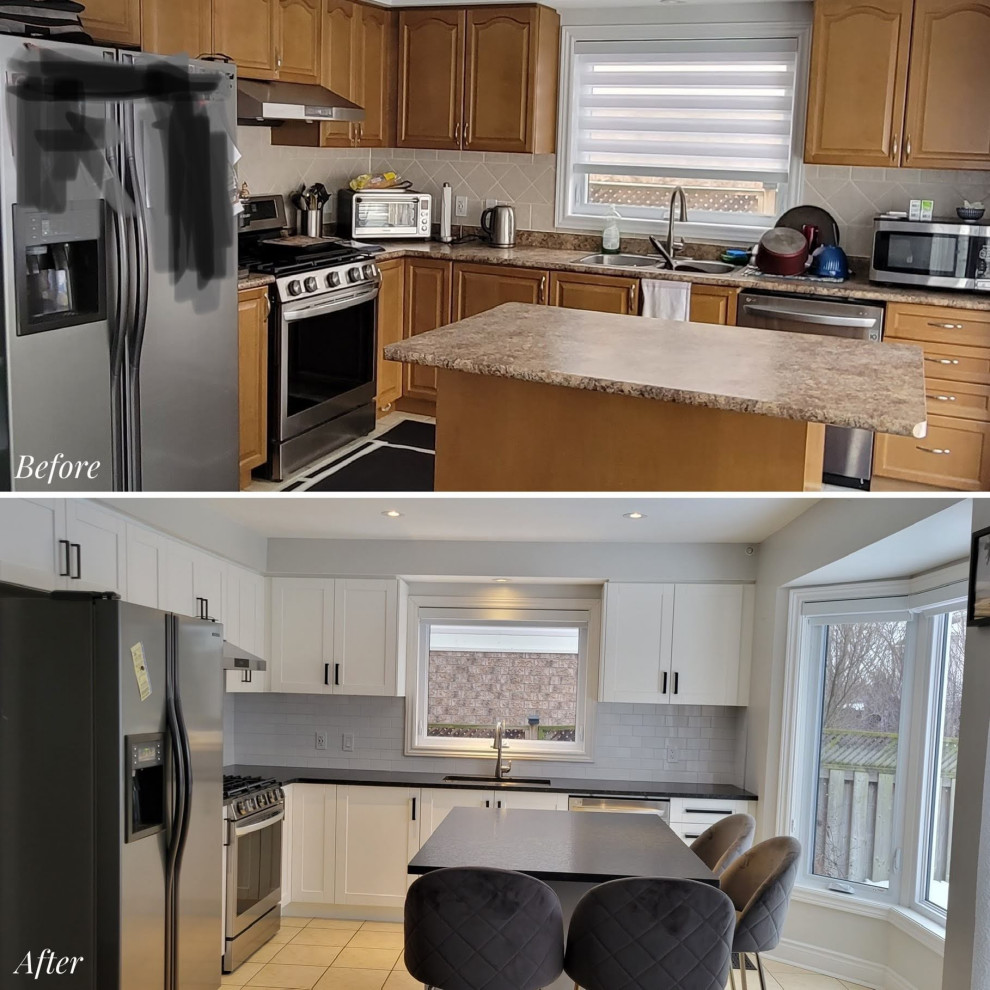 Eat-in kitchen - transitional l-shaped eat-in kitchen idea with an undermount sink, recessed-panel cabinets, white cabinets, granite countertops, gray backsplash, porcelain backsplash, stainless steel appliances, an island and black countertops