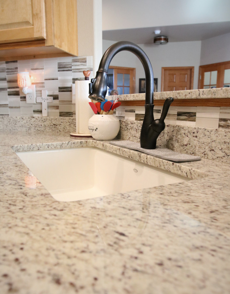Inspiration for a small eat-in kitchen remodel with granite countertops, multicolored backsplash, mosaic tile backsplash and multicolored countertops