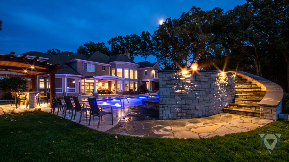 Pool fountain - large rustic backyard stone and rectangular natural pool fountain idea in Chicago