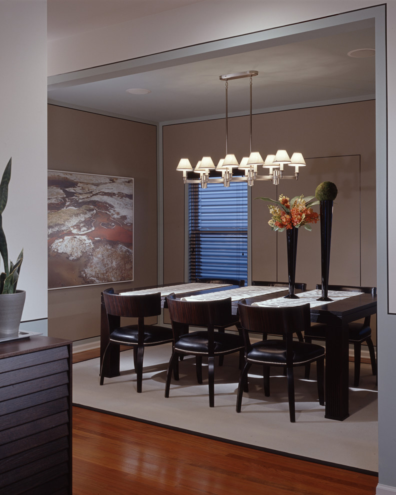 Modern dining room in Los Angeles with beige walls.