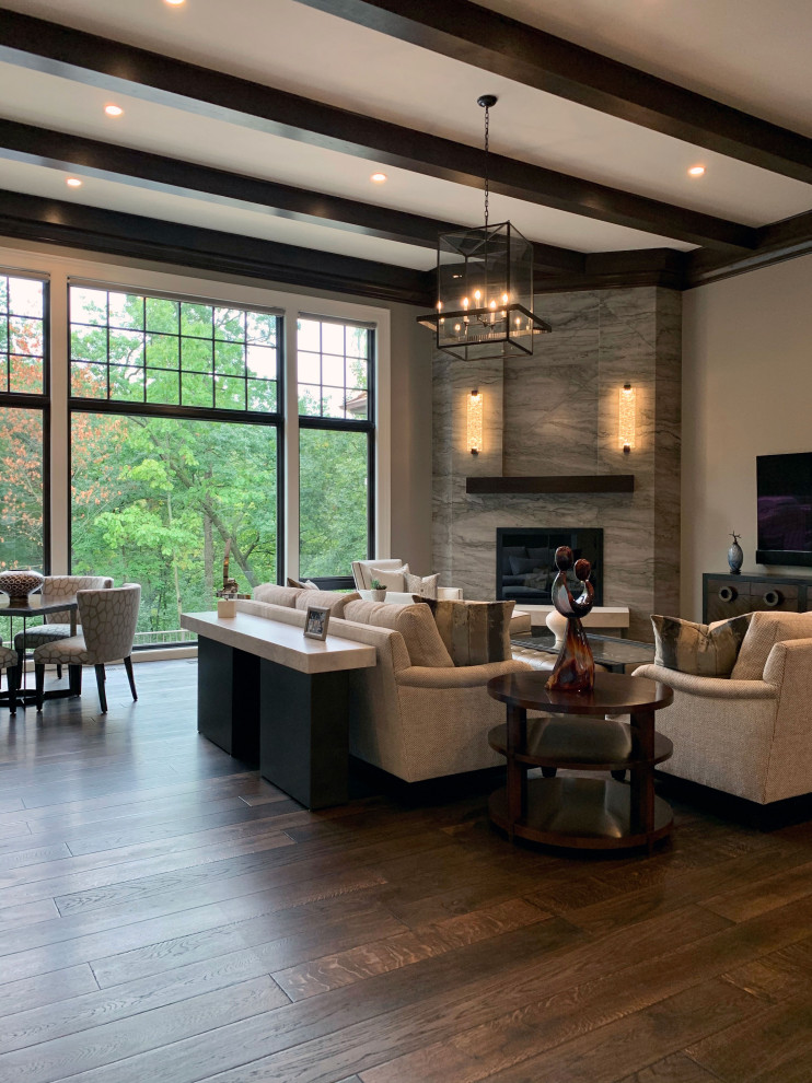 Inspiration for an expansive traditional open concept living room in Chicago with dark hardwood floors, a corner fireplace, a stone fireplace surround, brown floor and exposed beam.