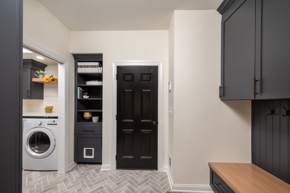 Large transitional u-shaped porcelain tile and multicolored floor utility room photo in Other with an undermount sink, recessed-panel cabinets, gray cabinets, granite countertops, white walls, a side-by-side washer/dryer and white countertops