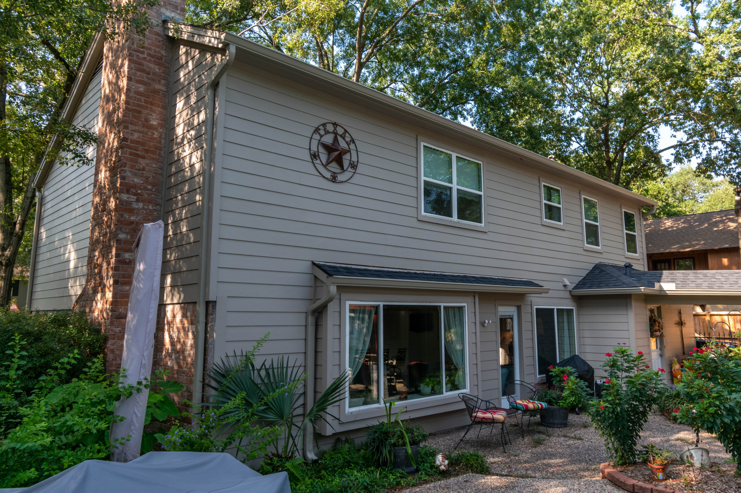 This project started as a full re-side with smooth Hardie plank, a full re-paint using Sherwin Williams Emerald paint, a 17'x21' patio cover and a massive outdoor kitchen.