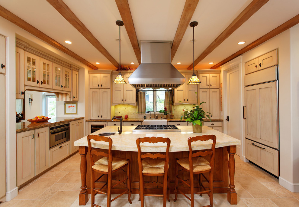 Photo of a traditional kitchen in San Diego with recessed-panel cabinets, white cabinets and panelled appliances.