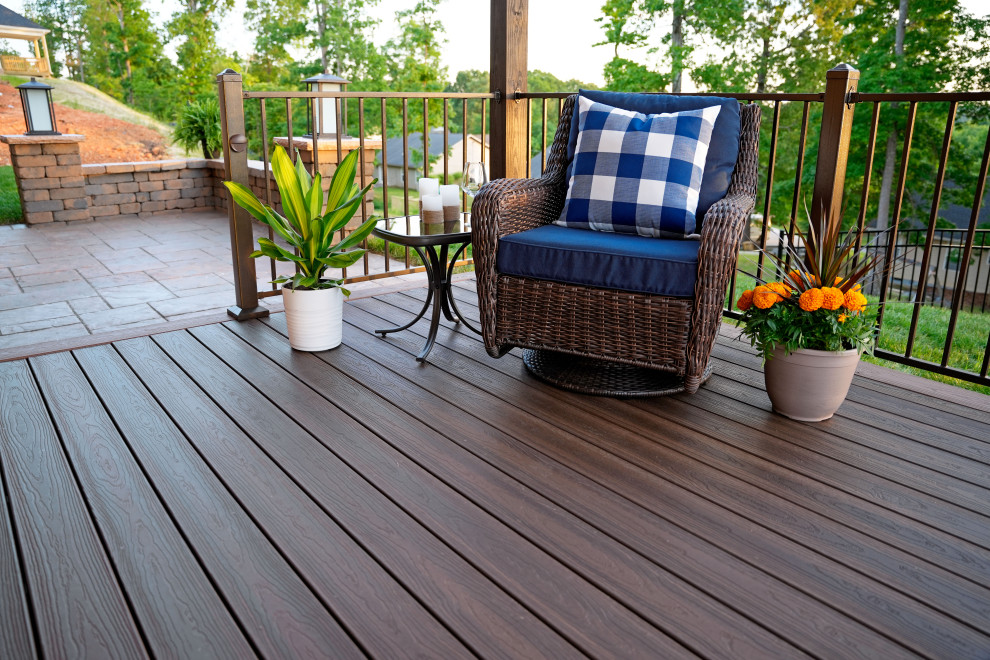 This is an example of a small traditional backyard and ground level deck in Other.