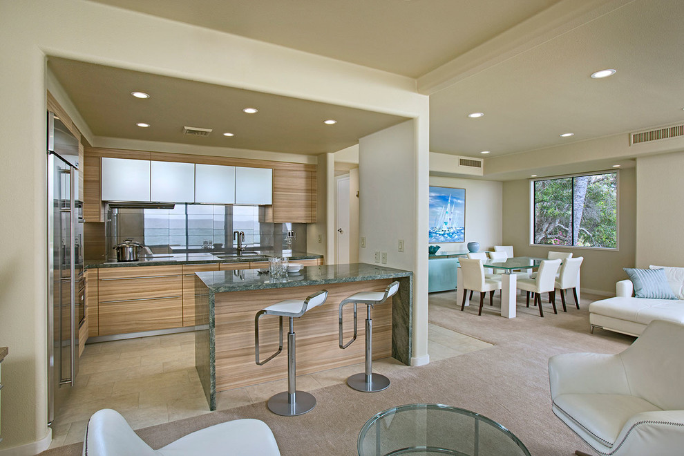 Example of a trendy porcelain tile kitchen design in Hawaii with a single-bowl sink, flat-panel cabinets, medium tone wood cabinets, granite countertops, metallic backsplash, porcelain backsplash and stainless steel appliances