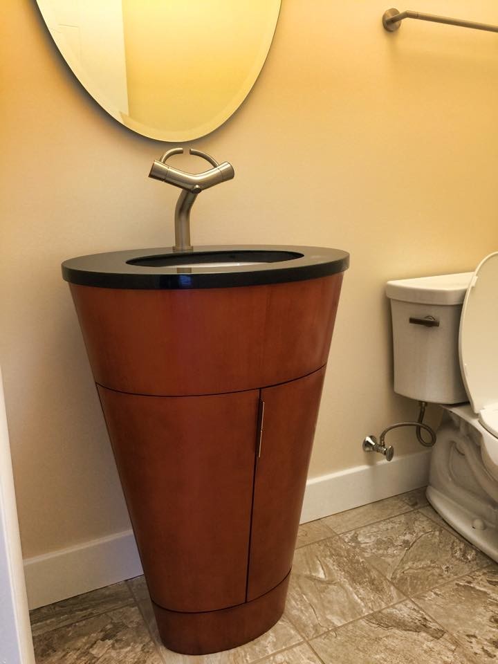 Inspiration for a mid-sized master ceramic tile bathroom remodel with a drop-in sink, dark wood cabinets, solid surface countertops and beige walls