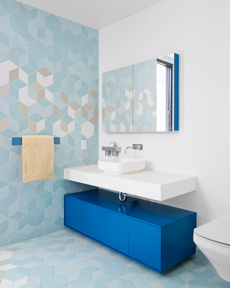 Inspiration for a contemporary bathroom in San Francisco with flat-panel cabinets, blue cabinets, blue tile, a vessel sink, blue floor, white benchtops, a single vanity and a floating vanity.