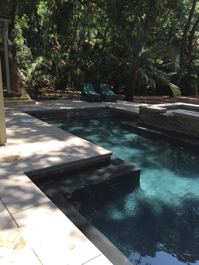 Small transitional backyard concrete paver and l-shaped lap hot tub photo