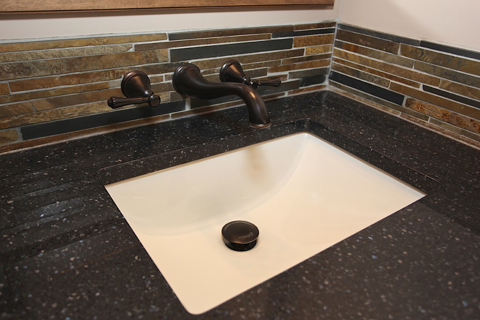 Inspiration for a large rustic master slate tile brown floor home design remodel in Indianapolis with brown cabinets, beige walls and an undermount sink