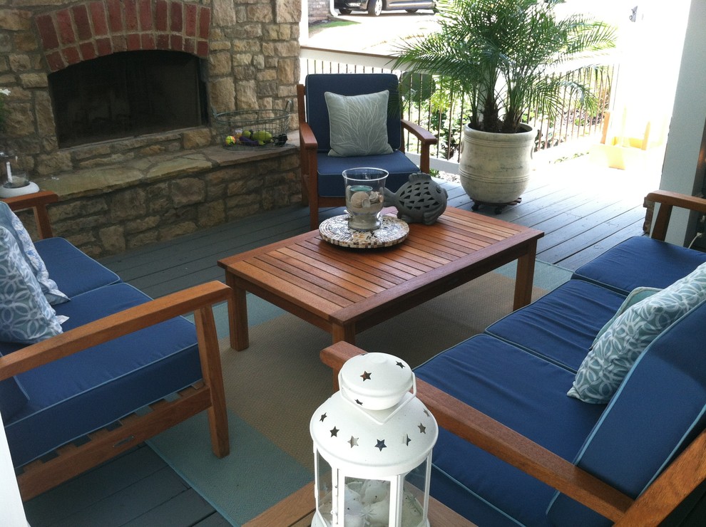 Inspiration for a mid-sized traditional front yard patio in Atlanta with a fire feature, decking and a roof extension.