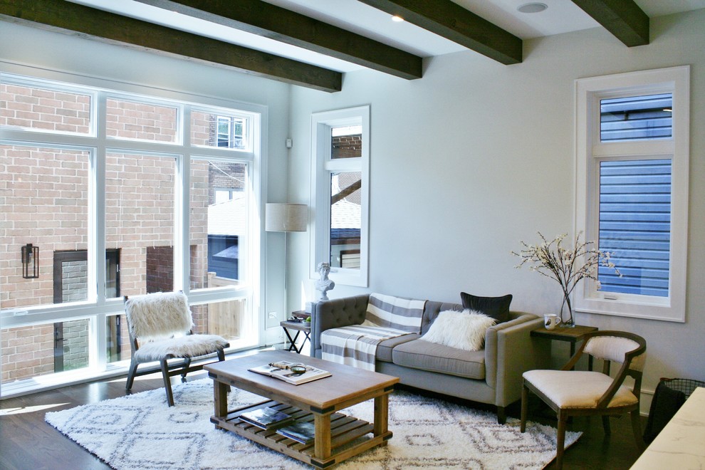 Inspiration for a huge transitional galley dark wood floor and brown floor open concept kitchen remodel in Chicago with an undermount sink, shaker cabinets, white cabinets, quartz countertops, white backsplash, subway tile backsplash, stainless steel appliances and an island