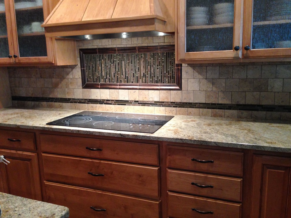 Kitchen - mid-sized transitional kitchen idea with raised-panel cabinets, medium tone wood cabinets, granite countertops, beige backsplash, ceramic backsplash, an island and beige countertops