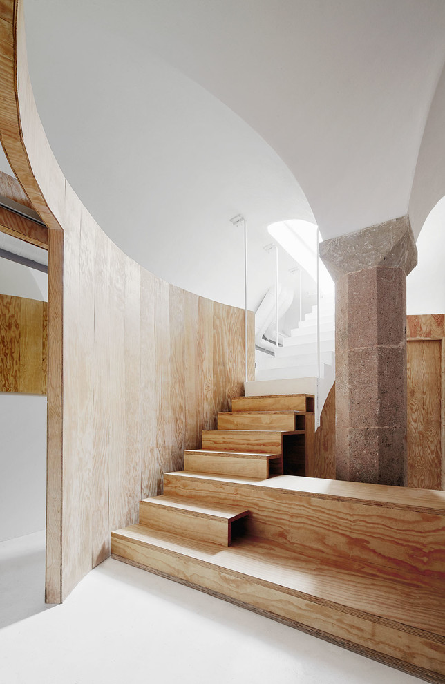 Design ideas for a large contemporary wood straight staircase in Barcelona with wood risers.