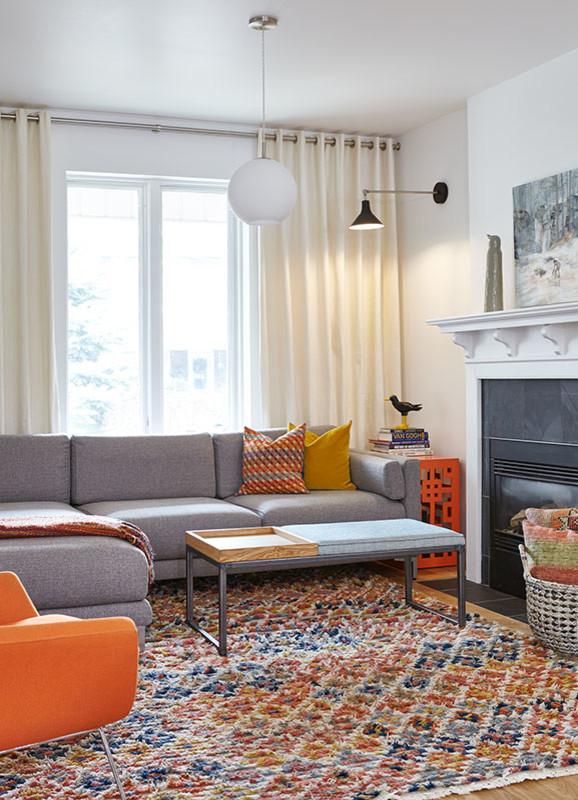 Inspiration for a mid-sized scandinavian open concept light wood floor and beige floor living room remodel in Toronto with white walls, a standard fireplace, a metal fireplace and no tv
