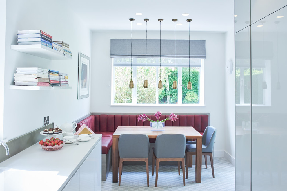 Inspiration for a contemporary kitchen/dining combo in London with white walls.