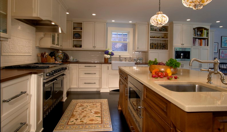 Large transitional l-shaped dark wood floor open concept kitchen photo in Seattle with a farmhouse sink, flat-panel cabinets, beige cabinets, wood countertops, beige backsplash, ceramic backsplash, stainless steel appliances and an island