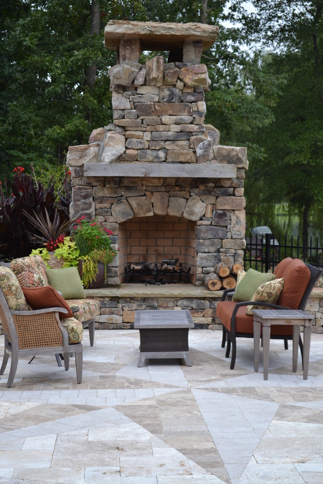 Traditional patio in Charlotte with a fire feature.