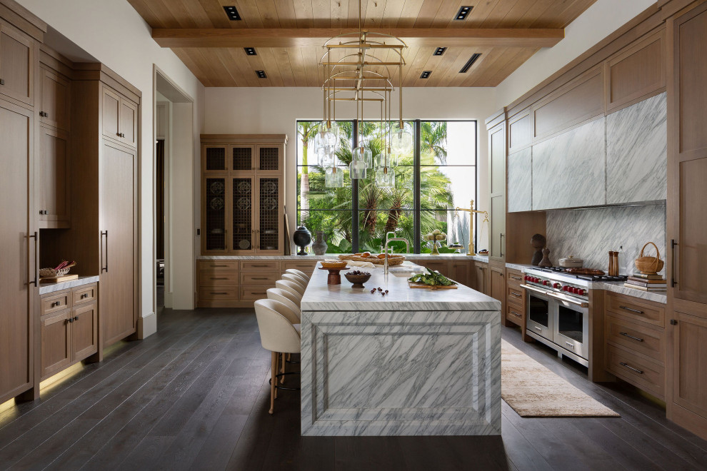 Transitional u-shaped dark wood floor, brown floor and wood ceiling kitchen photo with an undermount sink, shaker cabinets, light wood cabinets, gray backsplash, stone slab backsplash, stainless steel appliances, an island and gray countertops