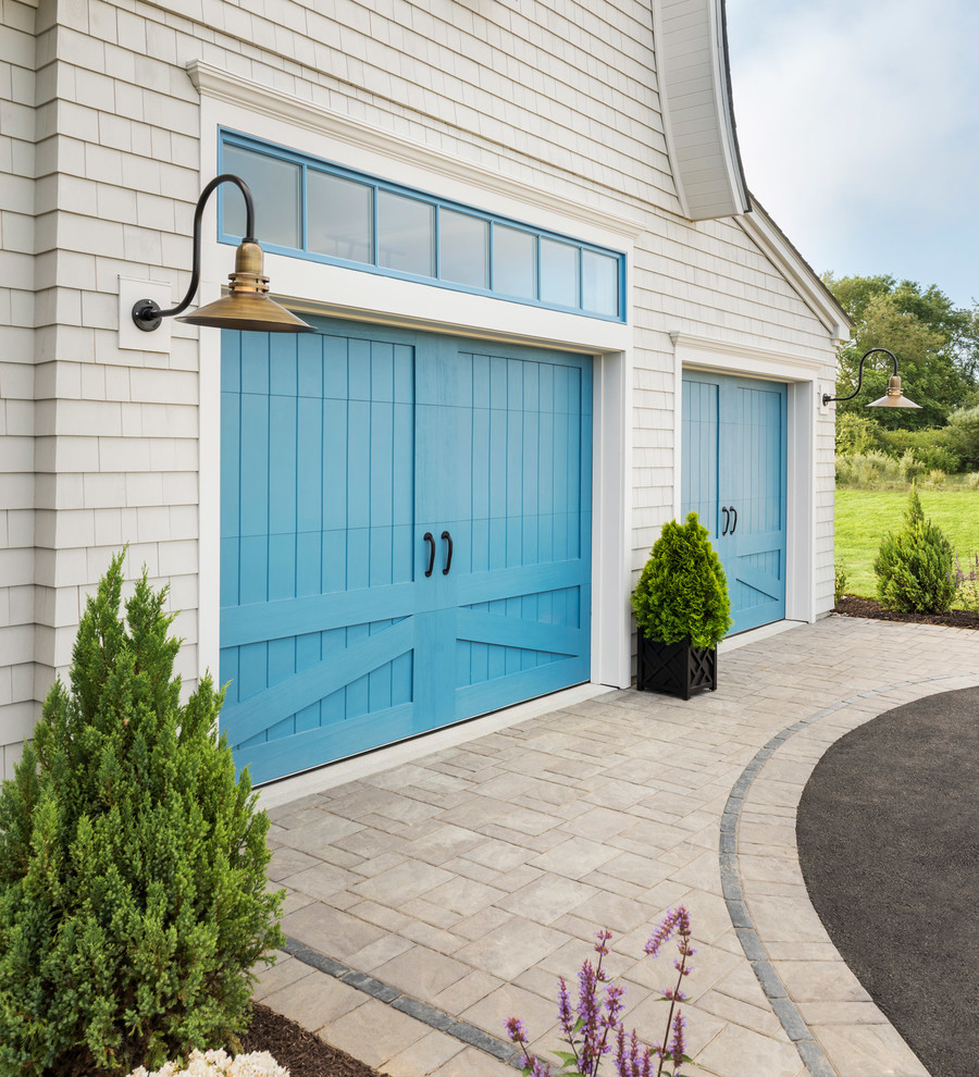 Design ideas for a large beach style attached two-car garage in Providence.